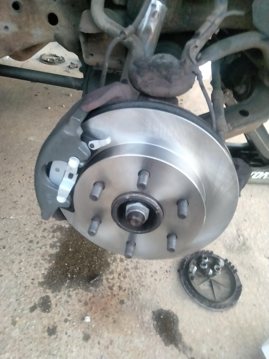 A brake rotor and wheel-bearing hub assembly being serviced